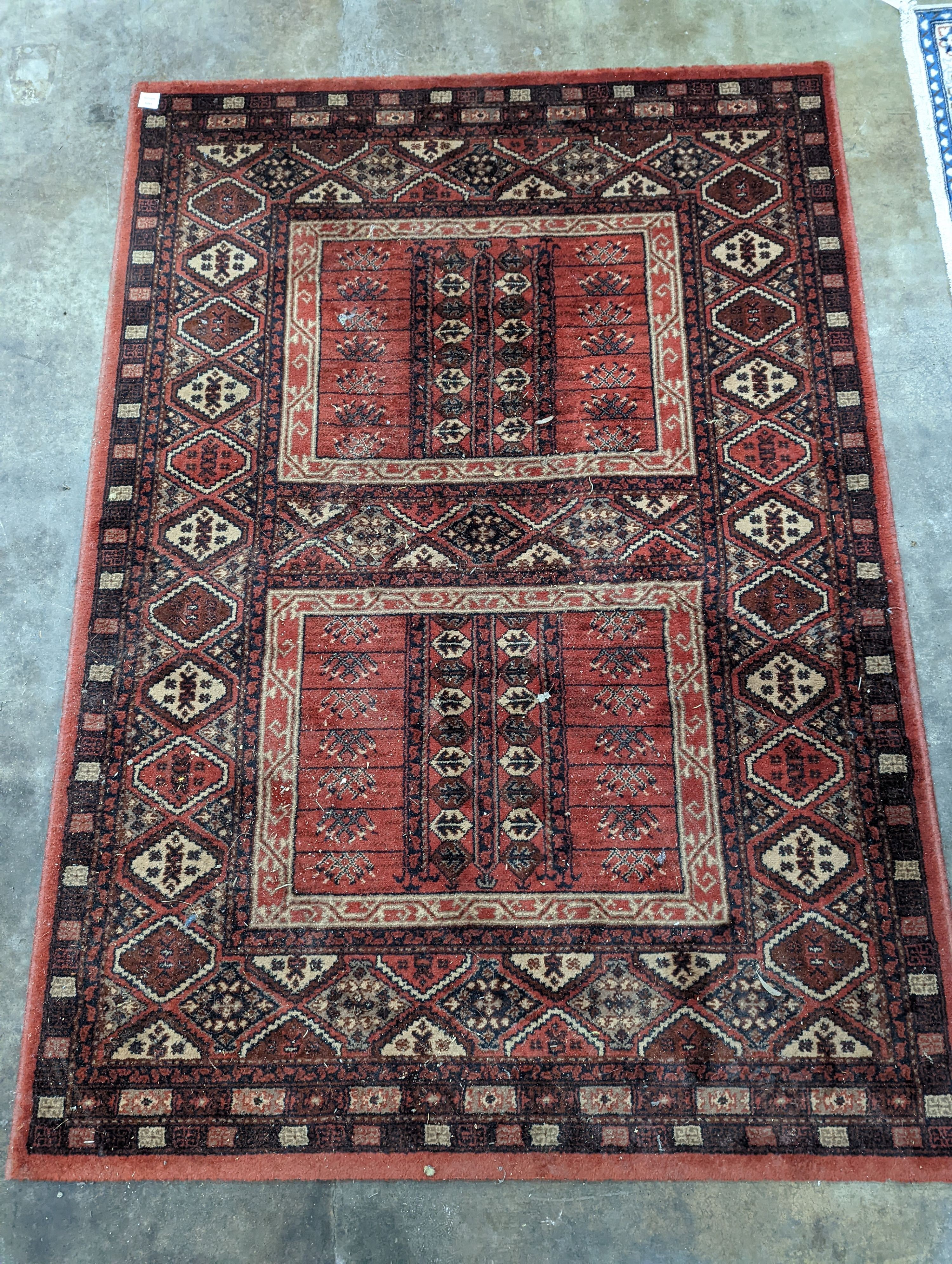 A Caucasian red ground rug, 190 x 136cm